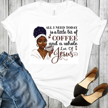 Load image into Gallery viewer, Young African American black woman with glasses on her face, hair in a bun, cross around her neck and holding a coffee cup on a white t-shirt with black shoes and blue jeans in the picture.
