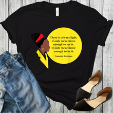 Load image into Gallery viewer, Amanda Gordan bust with red hair ban and gold earing yellow collar with the words There is always light, if inly we're brave enough to see it. If only we're brave enough to be it. Amanda Gordan on a black t-shirt with black shoes and blue jeans at the bottom corners of the picture.