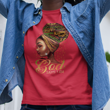 Load image into Gallery viewer, African American black woman wearing a red t-shirt with a young black woman's face and neckline with an earing and headband. Positive words in her hair bun. Gold colorful words by her neck saying 'God Says I Am'.