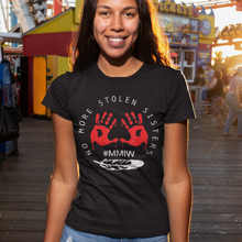 Load image into Gallery viewer, On this black t-shirt is #MMIW and the words no more stolen sisters and a feather in white. Red bloody hands in a circle.