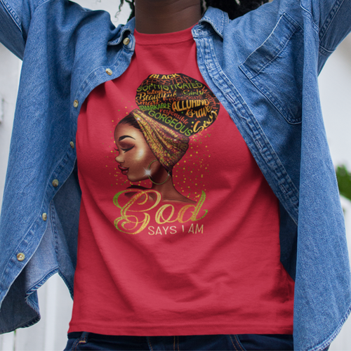 African American black woman wearing a red t-shirt with a young black woman's face and neckline with an earing and headband. Positive words in her hair bun. Gold colorful words by her neck saying 'God Says I Am'.