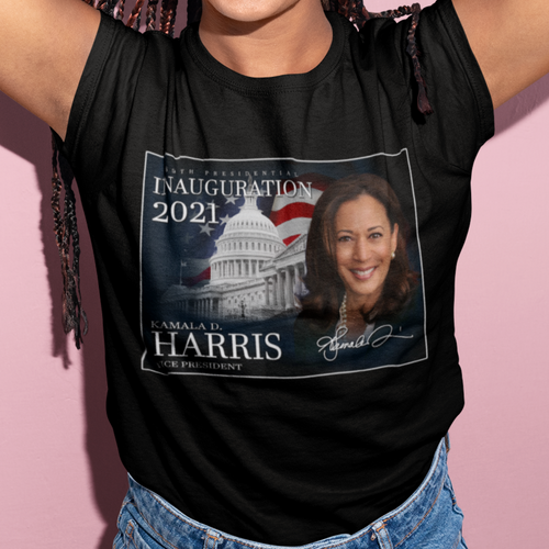 Vice President Kamala Harris with the flag and white house on a black t-shirt that a young black woman is wearing and she has blue jeans on and long braids. African American T-Shirt - Black Pride - Black History