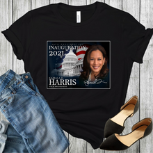 Load image into Gallery viewer, Vice President Kamala Harris with the flag and white house on a black t-shirt. With black shoes and blue jeans at the bottom corners of the picture.
